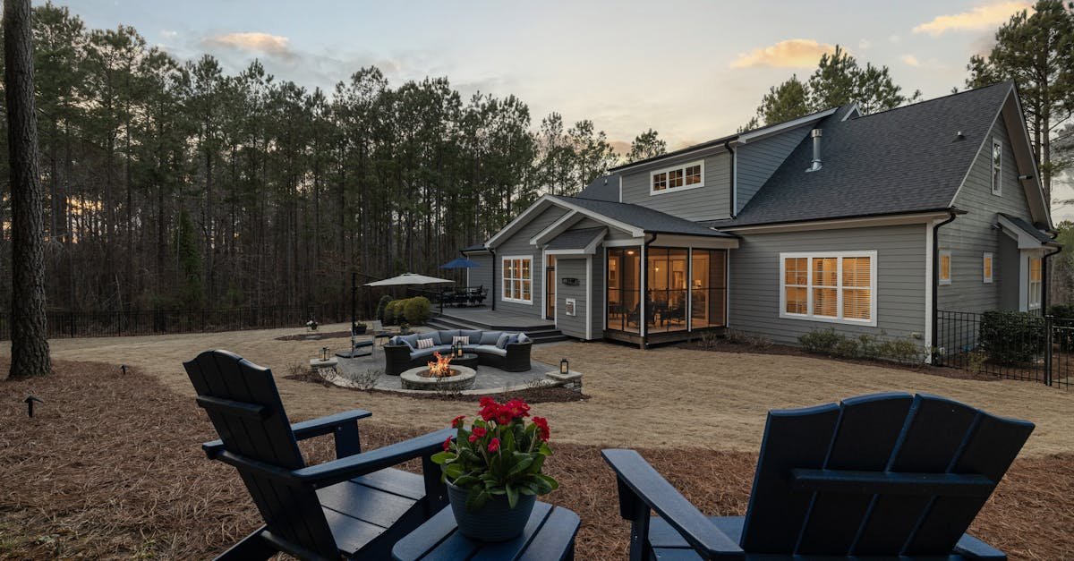 Backyard fire pit with seating at sunset