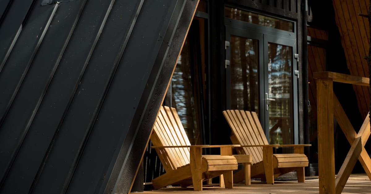 Wooden porch with Adirondack chairs in soft daylight