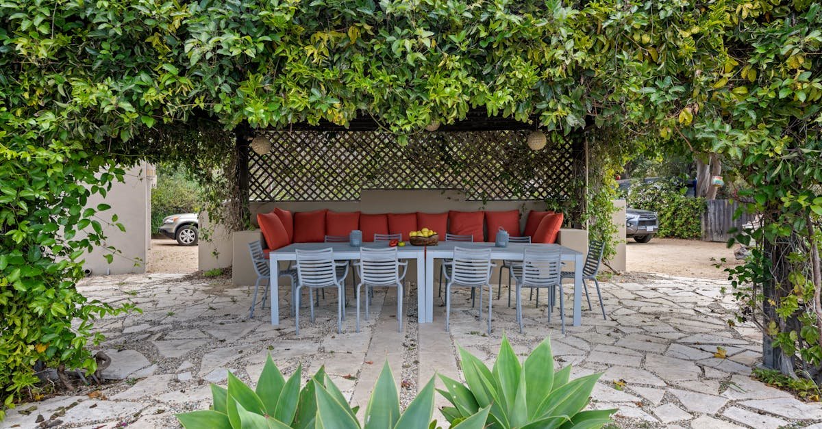 Cozy shaded patio with outdoor seating and greenery